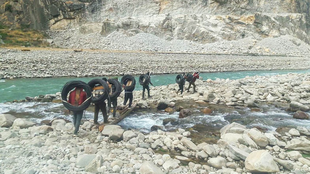 worldlink staff installing fiber internet equipment in Manaslu